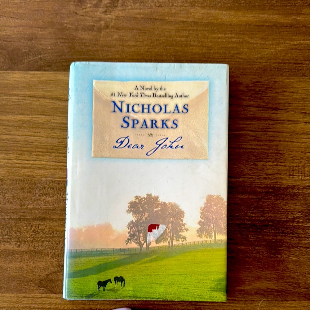 Selling a Nicholas Sparks Dear John book. Hard cover in great condition!